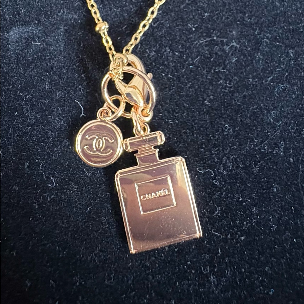 CHANEL charms on unbranded necklace